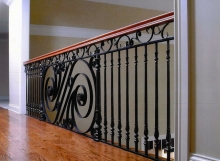 Finelli architectural iron and stairs custom hand forged iron balcony with wood railing cap in pepper pike ohio
