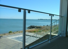 finelli architectural iron and stairs custom glass and iron panel balcony railing in put-in-bay- ohio
