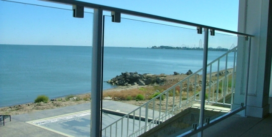 finelli architectural iron and stairs custom glass and iron panel balcony railing in put-in-bay- ohio