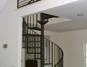 Finelli Architectural Iron and Stairs custom steel spiral staircase with wrought iron treads